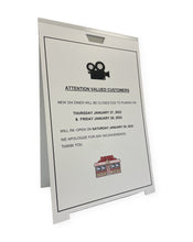 Load image into Gallery viewer, A-frame sign with a filming notice for a store's customers
